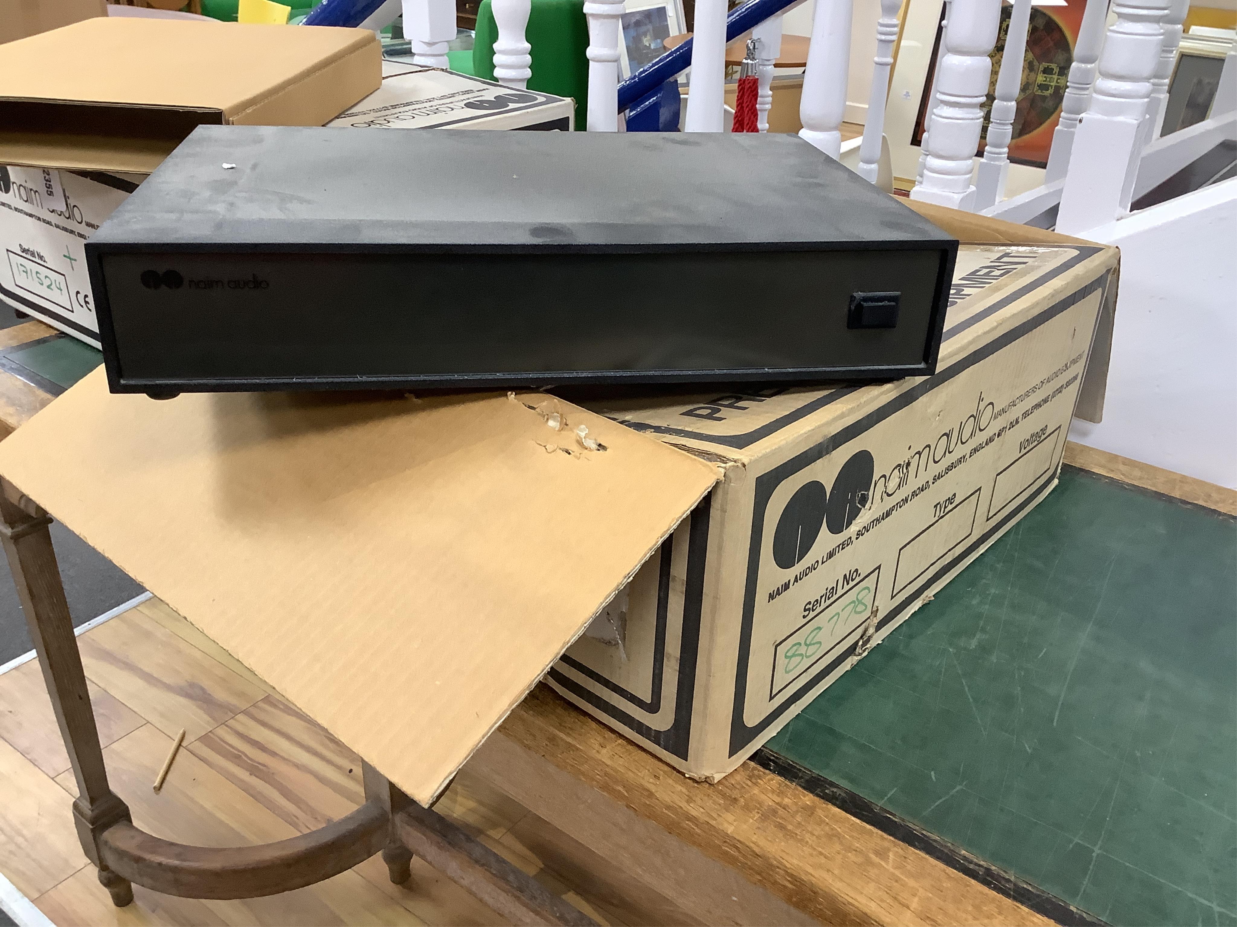 Seven Naim Audio hi-fi separates in original card boxes; a Niam HiCap DR power supply unit, serial number 70557, a Niam NAP 250 power amplifier, serial number 88778, a Niam NAT 02 FM Tuner, serial number 75339, a Niam NA